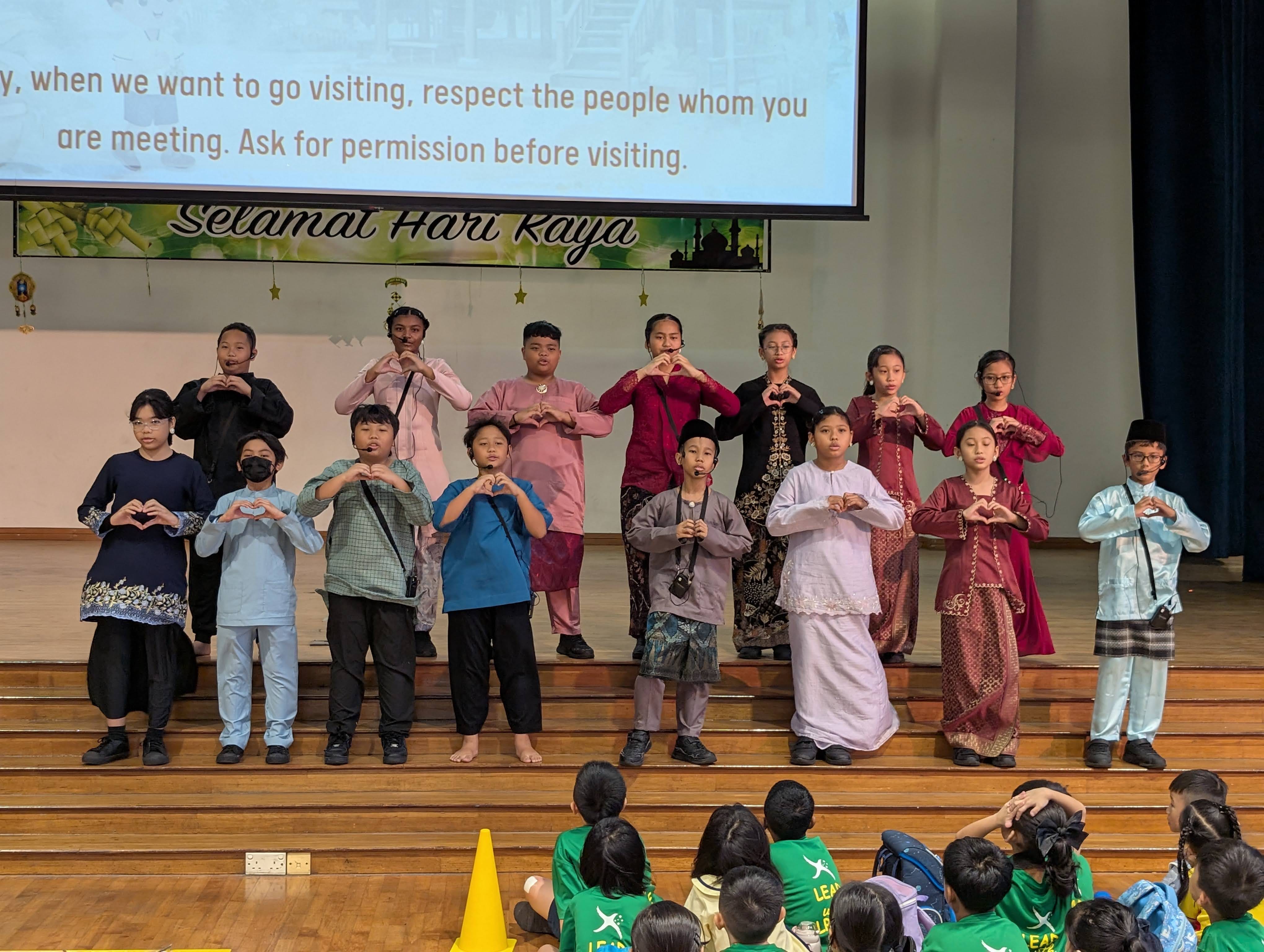 Student performers leading an engaging choral reading, highlighting important values through voice and expression.